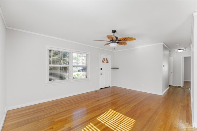 interior space with ceiling fan, ornamental molding, and light hardwood / wood-style floors