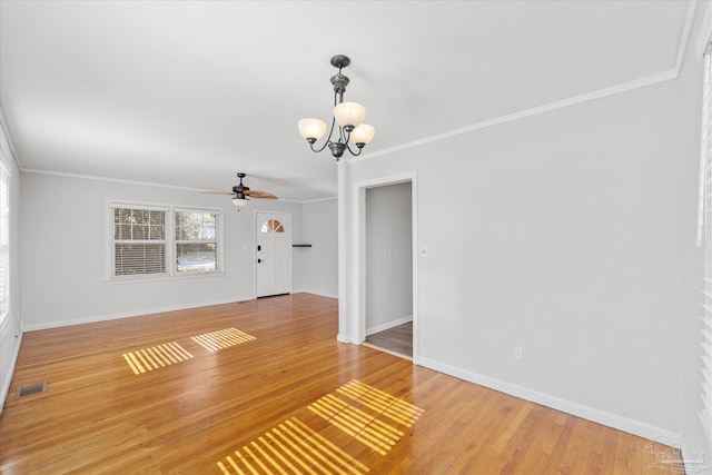 unfurnished room featuring ornamental molding, ceiling fan with notable chandelier, and wood-type flooring