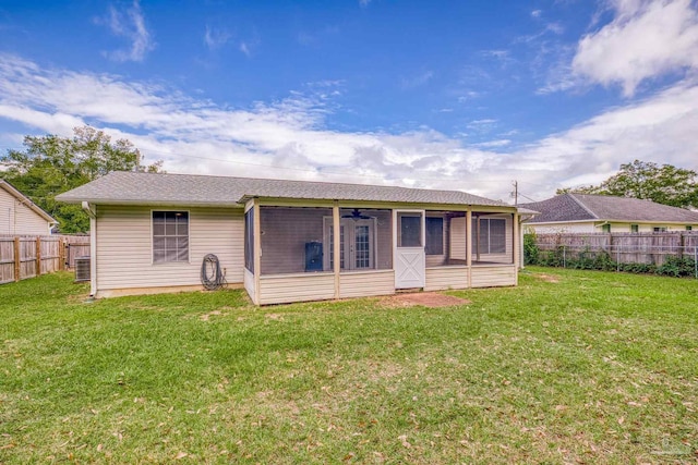 rear view of house with a lawn