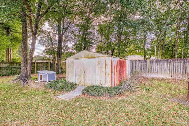 view of outbuilding featuring a lawn