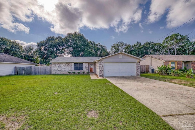 single story home with a garage and a front lawn