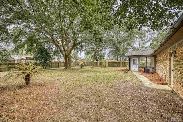 view of yard with central AC unit