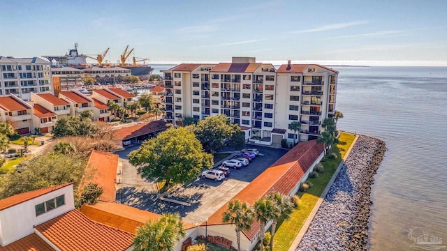 birds eye view of property with a water view