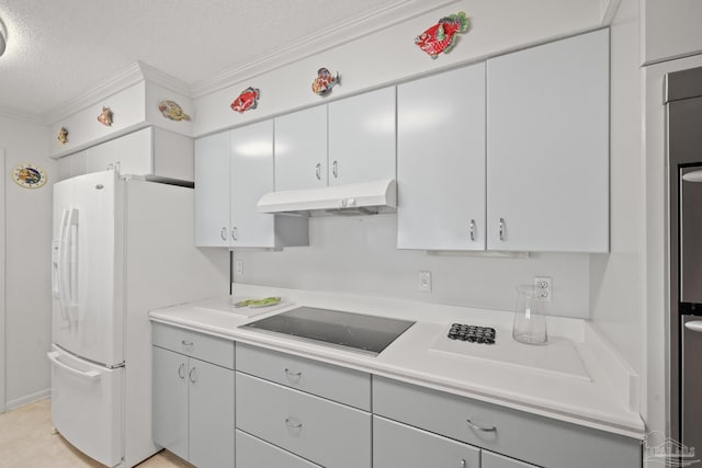 kitchen with a textured ceiling, black electric cooktop, white fridge with ice dispenser, and crown molding