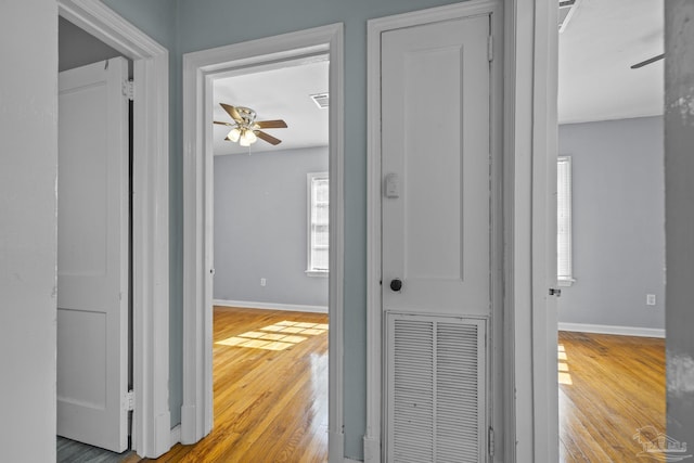 7074 Milton Ct, Milton, FL 32583 - hallway featuring hardwood / wood-style floors and baseboards