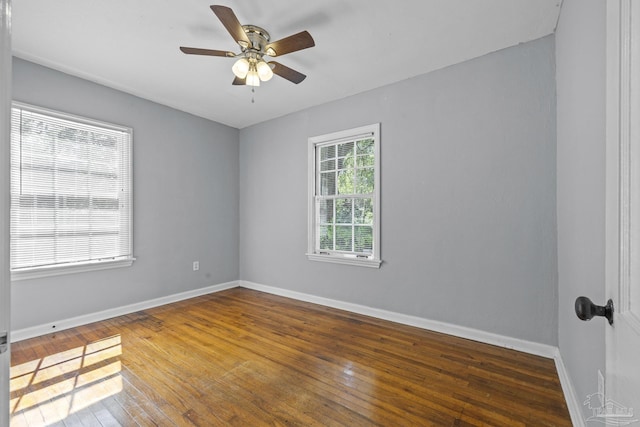 7074 Milton Ct, Milton, FL 32583 - unfurnished room with wood-type flooring, a ceiling fan, and baseboards