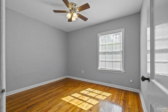 7074 Milton Ct, Milton, FL 32583 - spare room featuring wood-type flooring, ceiling fan, and baseboards