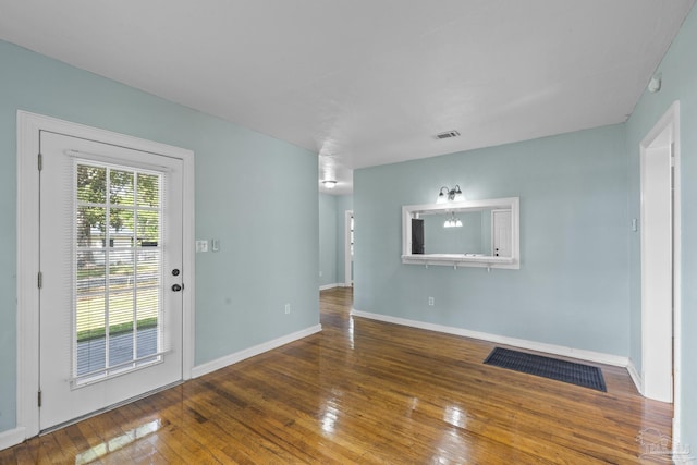 7074 Milton Ct, Milton, FL 32583 - spare room featuring hardwood / wood-style flooring and baseboards