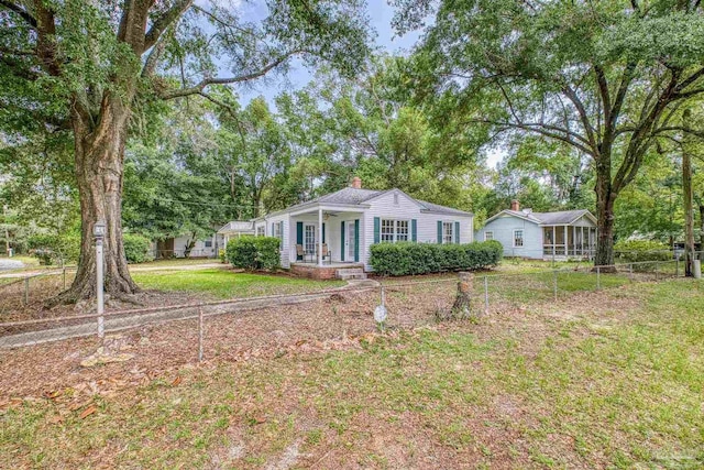 7074 Milton Ct, Milton, FL 32583 - view of front of property with a chimney and a porch