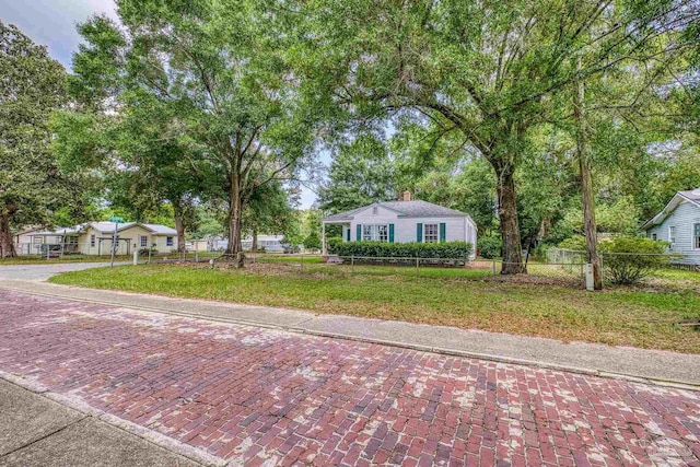 7074 Milton Ct, Milton, FL 32583 - view of front of house featuring a chimney