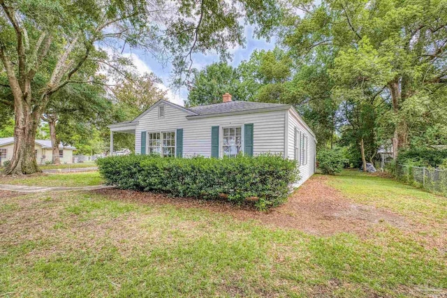 7074 Milton Ct, Milton, FL 32583 - view of front facade featuring a chimney