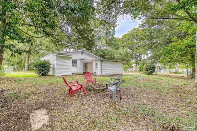 7074 Milton Ct, Milton, FL 32583 - view of yard with a fire pit and view of wooded area
