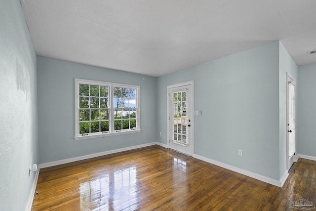 7074 Milton Ct, Milton, FL 32583 - empty room featuring hardwood / wood-style flooring and baseboards