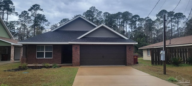 view of front of home featuring a front lawn and a garage