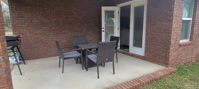 view of patio featuring outdoor dining area