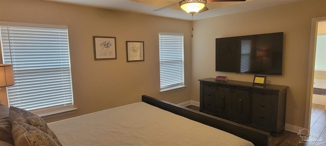 bedroom featuring baseboards and a ceiling fan