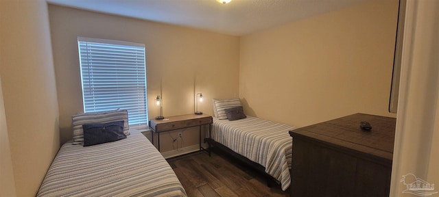 bedroom featuring dark wood-style floors