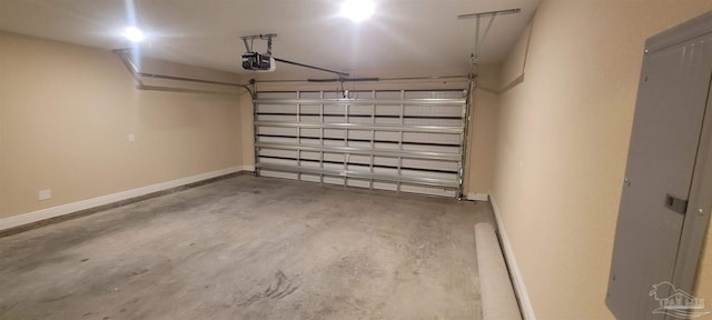 garage with baseboards and a garage door opener