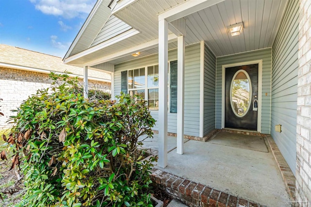 doorway to property featuring a porch