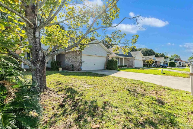 ranch-style house featuring brick siding, a residential view, concrete driveway, a front yard, and an attached garage