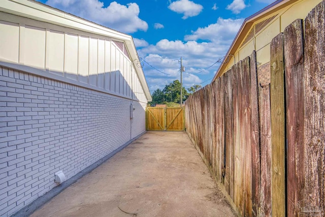 view of side of property featuring a patio