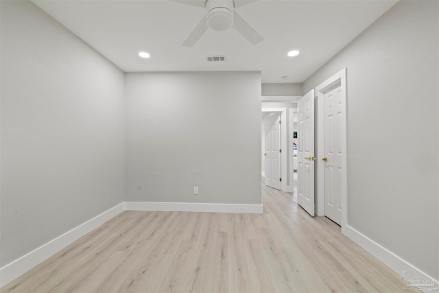 empty room with light wood-type flooring and ceiling fan