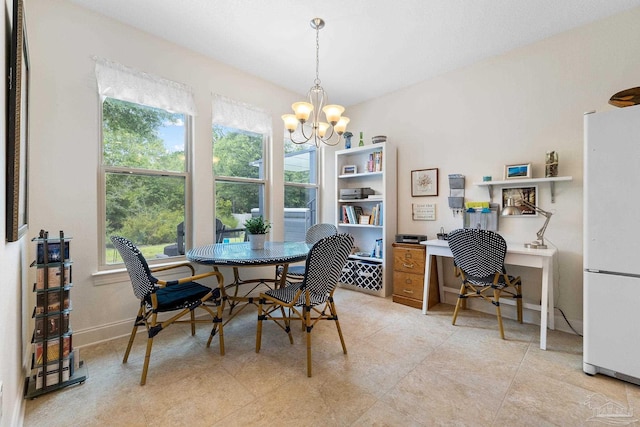 4951 Red Oak Dr, Milton, FL 32583 - dining area with baseboards and a notable chandelier
