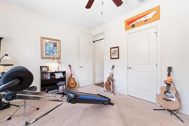 workout area with carpet flooring and ceiling fan