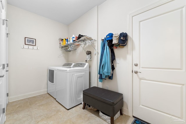 laundry room featuring washing machine and clothes dryer