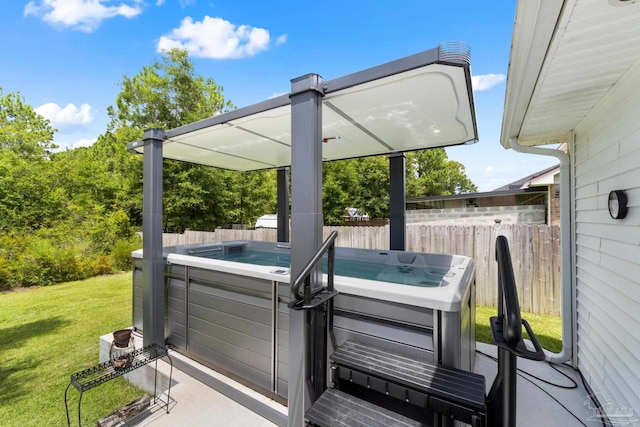 4951 Red Oak Dr, Milton, FL 32583 - view of patio / terrace with a hot tub and fence