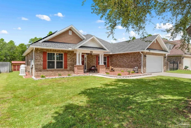 4951 Red Oak Dr, Milton, FL 32583 - view of front of house featuring brick siding, an attached garage, a front yard, and concrete driveway