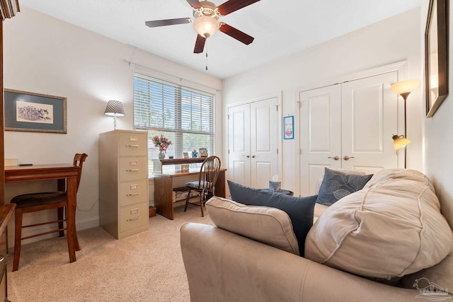 interior space featuring ceiling fan and light carpet