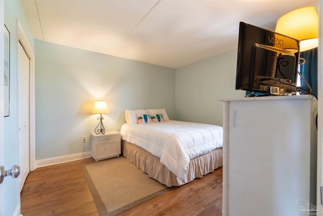 bedroom with hardwood / wood-style flooring