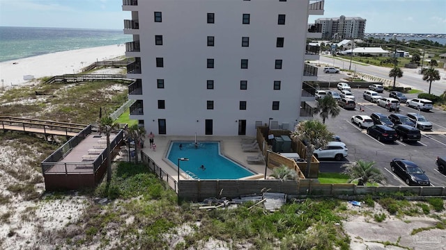 bird's eye view with a water view and a beach view