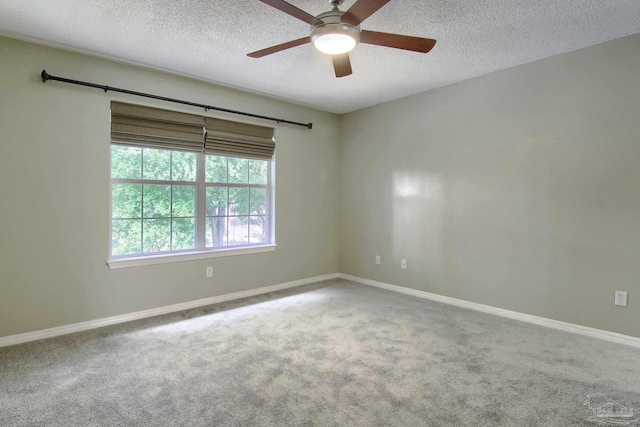 unfurnished room featuring carpet, a textured ceiling, and ceiling fan