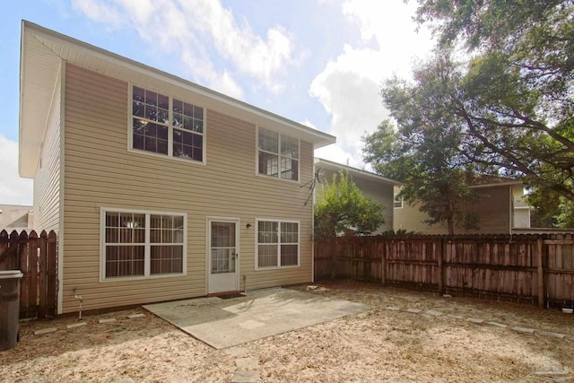 rear view of property featuring a patio