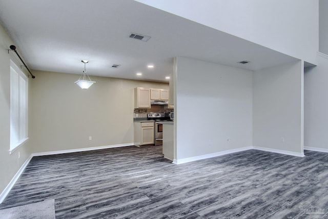 unfurnished living room with dark hardwood / wood-style floors