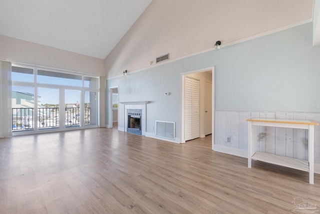 14100 River Rd Unit 324, Pensacola, FL 32507 - unfurnished living room with light wood-style flooring, a fireplace, and visible vents