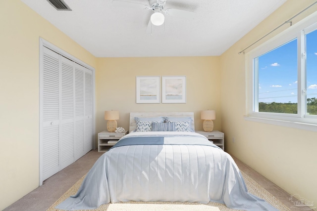 14100 River Rd Unit 324, Pensacola, FL 32507 - bedroom featuring carpet flooring, visible vents, a closet, and ceiling fan