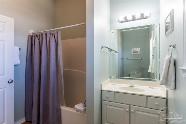 full bathroom featuring toilet, vanity, and shower / tub combo