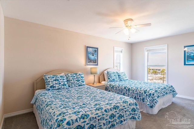 bedroom with baseboards, carpet floors, and ceiling fan