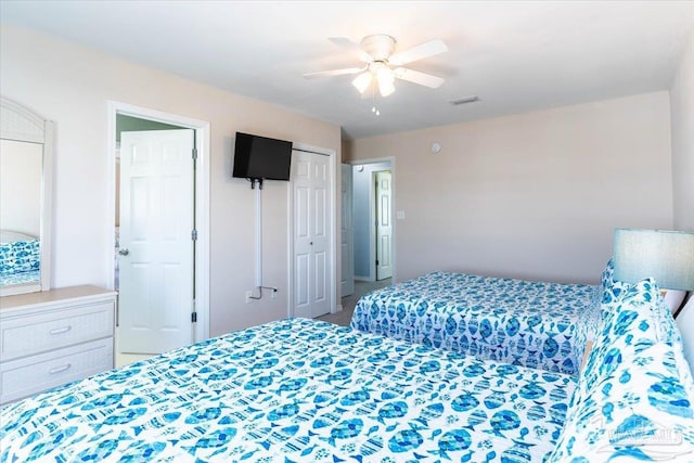 bedroom featuring visible vents and ceiling fan