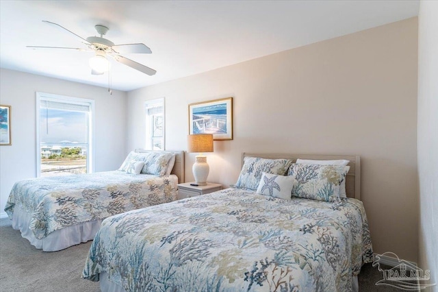 bedroom with ceiling fan and carpet floors