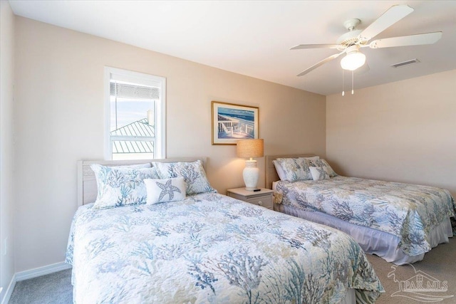 bedroom with visible vents, baseboards, carpet, and ceiling fan