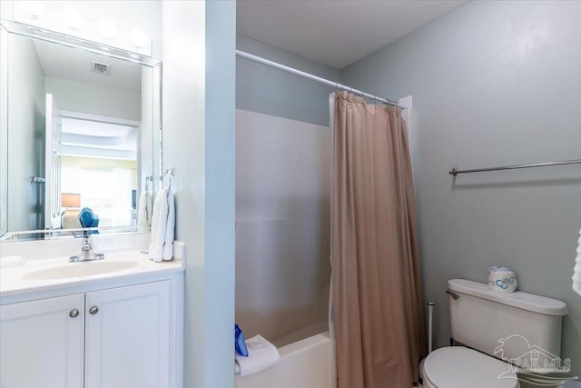 full bath featuring visible vents, toilet, vanity, and shower / tub combo with curtain