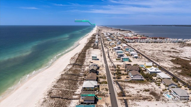 drone / aerial view with a view of the beach and a water view