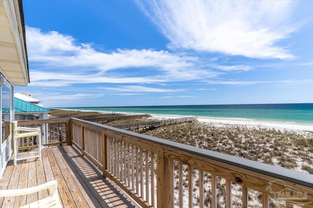 balcony with a beach view and a water view