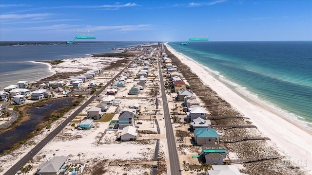 birds eye view of property with a view of the beach and a water view