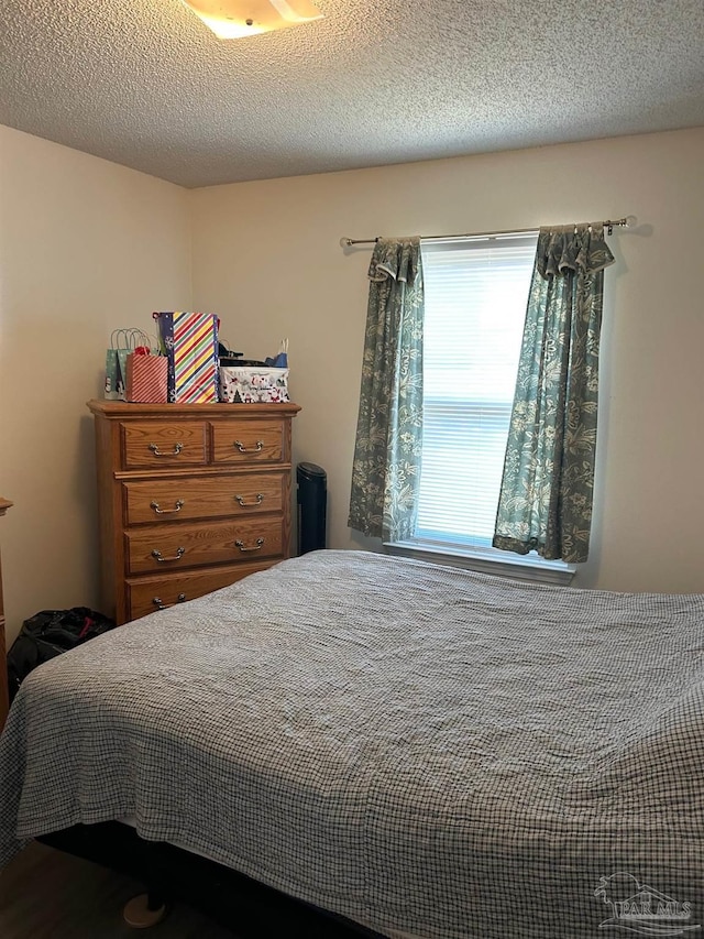 bedroom featuring a textured ceiling