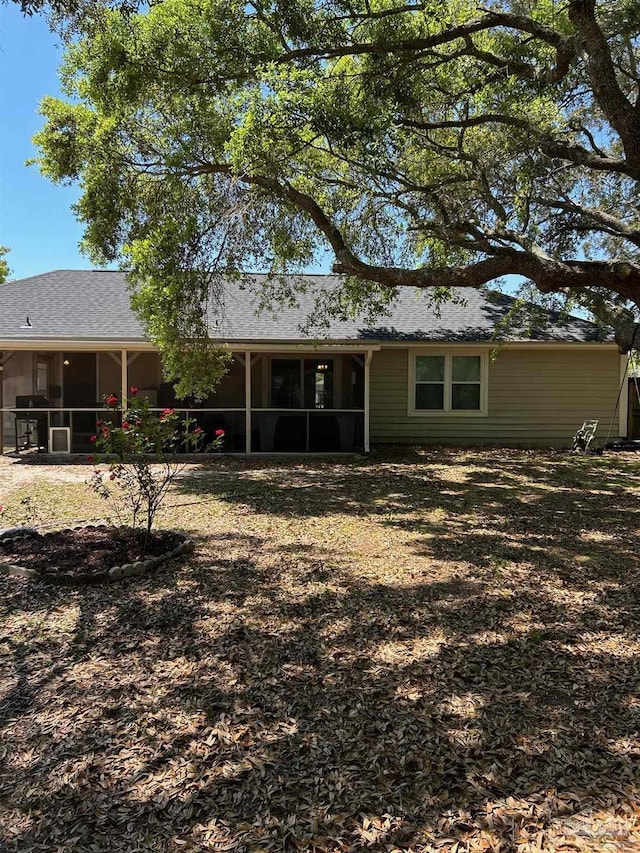 back of property featuring a sunroom